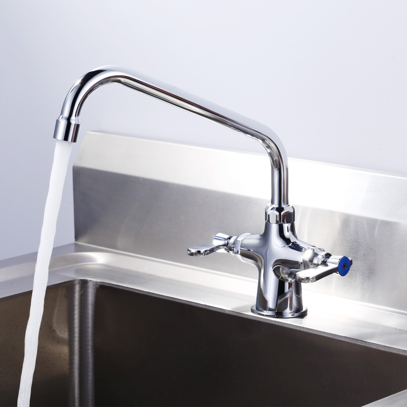 Commercial Double Handle Kitchen Faucet Installed on Stainless Steel Sink
